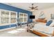 Nautical bedroom featuring large windows, ceiling fan, and tasteful decor at 487 Lantana Circle, Georgetown, SC 29440