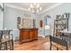 Elegant dining area with a wooden bar, wine racks and shelving at 487 Lantana Circle, Georgetown, SC 29440