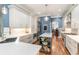 Gourmet kitchen features custom cabinets, stainless steel appliances, and a large island with a prep sink at 487 Lantana Circle, Georgetown, SC 29440