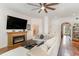 Spacious living room with a fireplace, hardwood floors, and neutral-toned furnishings at 487 Lantana Circle, Georgetown, SC 29440