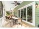 Outdoor screened in porch with ceiling fans overlooking the backyard at 487 Lantana Circle, Georgetown, SC 29440