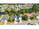 Neighborhood aerial showing a mix of homes and winding waterways surrounded by lush trees and greenery at 5036 Billy K Trail, Myrtle Beach, SC 29579