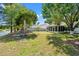 Large backyard featuring a fire pit and chairs, offering tranquil water views and a peaceful outdoor retreat at 5036 Billy K Trail, Myrtle Beach, SC 29579