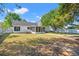 Expansive backyard featuring a screened porch and outdoor dining area, perfect for entertaining at 5036 Billy K Trail, Myrtle Beach, SC 29579