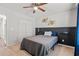 Bedroom with neutral carpet, ceiling fan, and access to en-suite bathroom at 5036 Billy K Trail, Myrtle Beach, SC 29579