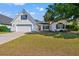 Charming home featuring a well-manicured lawn and a two-car garage and a large, mature tree at 5036 Billy K Trail, Myrtle Beach, SC 29579