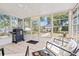 Bright sunroom with lots of windows and a view of the backyard; grill included at 5036 Billy K Trail, Myrtle Beach, SC 29579