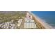 Aerial view of the coastline with oceanfront condo buildings and residential homes at 5200 N Ocean Blvd. # 833, Myrtle Beach, SC 29577