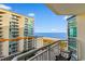 View from the balcony of the ocean, beach, palm trees, and neighboring buildings at 5200 N Ocean Blvd. # 833, Myrtle Beach, SC 29577