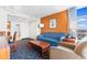 Cozy living room with blue sofa, wood coffee table, art and colorful carpet at 5200 N Ocean Blvd. # 833, Myrtle Beach, SC 29577