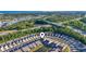 Aerial view of community near pond and wooded areas with distant city views at 5876 Cremona Dr., Myrtle Beach, SC 29577