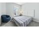 Cozy bedroom with a comfortable bed, a large window, and a cozy chair bathed in natural light at 5876 Cremona Dr., Myrtle Beach, SC 29577