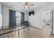 Bedroom with hardwood floors, window with curtains, and a view of the exterior at 5876 Cremona Dr., Myrtle Beach, SC 29577