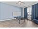 Bedroom with hardwood floors, window with curtains, and a view of the exterior at 5876 Cremona Dr., Myrtle Beach, SC 29577