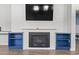 Shiplap fireplace with blue built-ins and wood mantle at 5876 Cremona Dr., Myrtle Beach, SC 29577