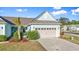 Charming single-story home with a two-car garage, well-maintained lawn, and a blue exterior paint scheme at 5876 Cremona Dr., Myrtle Beach, SC 29577