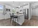 Modern kitchen featuring a center island, stainless steel appliances, and white cabinetry at 5876 Cremona Dr., Myrtle Beach, SC 29577