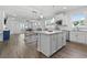 Open-concept living space, featuring a modern kitchen island and dining area at 5876 Cremona Dr., Myrtle Beach, SC 29577