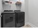Spacious laundry room with side by side washer and dryer and ample shelving for storage at 5876 Cremona Dr., Myrtle Beach, SC 29577