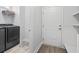 Well-equipped laundry room with modern appliances and shelving for storage at 5876 Cremona Dr., Myrtle Beach, SC 29577