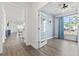 Bright office space featuring hardwood floors, natural light, and blue accent wall at 5876 Cremona Dr., Myrtle Beach, SC 29577