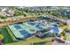 Aerial view of community pickleball courts with fencing, landscaping, and nearby residential buildings at 5876 Cremona Dr., Myrtle Beach, SC 29577