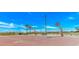 Enjoy ocean views from this basketball court with hoops and a red surface, surrounded by palm trees and blue sky at 6001-5610 S Kings Hwy., Myrtle Beach, SC 29575
