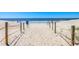 Sandy beach path leads to the ocean, inviting exploration and relaxation by the seaside at 6001-5610 S Kings Hwy., Myrtle Beach, SC 29575