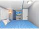 Comfortable bedroom with a TV and blue accents for a relaxing and modern space at 6001-5610 S Kings Hwy., Myrtle Beach, SC 29575