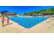 Large, inviting community pool area with clear water, lounge chairs, and a lifeguard at 6001-5610 S Kings Hwy., Myrtle Beach, SC 29575