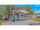 Charming single-story home with a red roof, a cozy front porch, and lush landscaping at 6001-5610 S Kings Hwy., Myrtle Beach, SC 29575