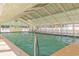 Spacious indoor pool with a glass ceiling, seating, and a relaxing atmosphere for year-round enjoyment at 6001-5610 S Kings Hwy., Myrtle Beach, SC 29575