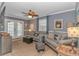 Living room with tile flooring, comfortable seating, and a french door leading to the outdoors at 6001-5610 S Kings Hwy., Myrtle Beach, SC 29575