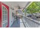 Relaxing porch with outdoor seating, ceiling fan, and mounted tv at 6001-5610 S Kings Hwy., Myrtle Beach, SC 29575