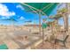 Outdoor community area featuring benches, bike racks, and shade structures near the beach at 6001-5610 S Kings Hwy., Myrtle Beach, SC 29575