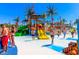 A vibrant community water park with colorful slides, splash zones, and palm trees for Gathering fun at 6001-5610 S Kings Hwy., Myrtle Beach, SC 29575