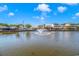 Scenic waterfront view of community homes with fountain, docks and lush landscaping at 6001-5610 S Kings Hwy., Myrtle Beach, SC 29575