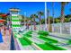 Exciting water slide with having fun and palm trees in the background for a thrilling experience at 6001-5610 S Kings Hwy., Myrtle Beach, SC 29575