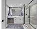 Large bathroom with a double vanity, walk-in shower, and modern finishes at 603 S Ocean Blvd. # 1101, North Myrtle Beach, SC 29582
