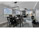 Modern dining room with stylish furniture, a decorative rug, and an elegant chandelier at 603 S Ocean Blvd. # 1101, North Myrtle Beach, SC 29582