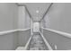 Neutral hallway with fresh paint, white trim and baseboards, and a tasteful runner at 603 S Ocean Blvd. # 1101, North Myrtle Beach, SC 29582