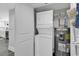 A convenient laundry closet with a stackable washer and dryer, plus the hot water system at 603 S Ocean Blvd. # 1101, North Myrtle Beach, SC 29582