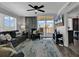 Comfortable living room features sliding glass doors leading to a balcony and coastal-themed decor at 603 S Ocean Blvd. # 1101, North Myrtle Beach, SC 29582