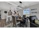 A modern dining area and kitchen feature an island with bar stools, open concept at 603 S Ocean Blvd. # 1101, North Myrtle Beach, SC 29582
