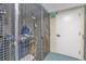 Unit caged with personal items stored next to white exit door for tenant use at 603 S Ocean Blvd. # 1101, North Myrtle Beach, SC 29582