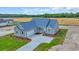 Beautiful aerial view of the landscaped home with a long driveway and three car garage at 604 Highway 747, Loris, SC 29569