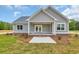 The house has a back patio with white columns and a brick foundation at 604 Highway 747, Loris, SC 29569