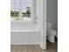 Bathroom includes a modern soaking tub, shower combo and toilet at 604 Highway 747, Loris, SC 29569