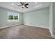 This bedroom includes a ceiling fan, recessed lighting, and a large window at 604 Highway 747, Loris, SC 29569
