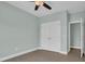 Bedroom with a ceiling fan, closet, and ensuite bathroom at 604 Highway 747, Loris, SC 29569